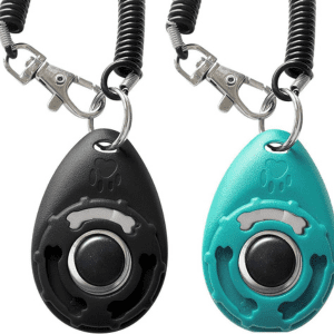 Two ergonomic dog training clickers with wrist coils, perfect for quick and easy access.